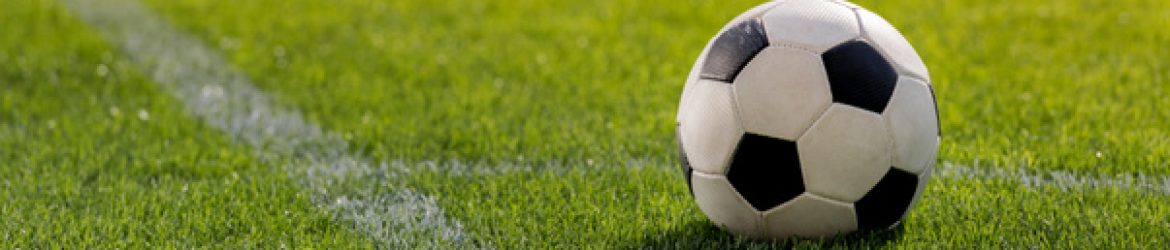 cropped-stock-photo-soccer-ball-on-grass.jpg